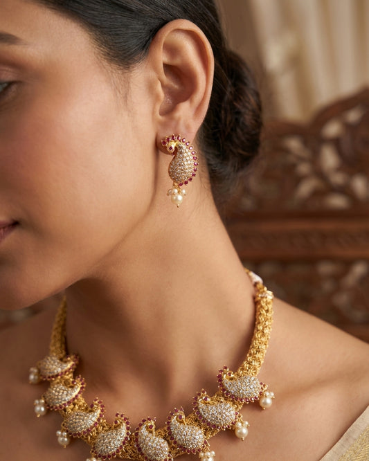 The woman wearing the jewelry is AI generated for representation purposes.