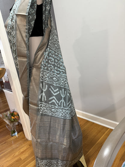 Hand block Batik Gray Maheshwari Silk Saree with silver zari border.