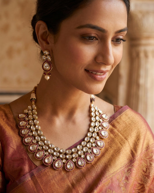 The woman wearing the jewelry is AI generated for representation purposes.