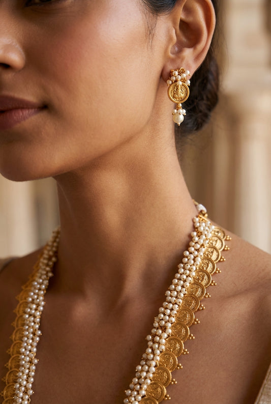 The woman wearing the jewelry is AI generated for representation purposes.