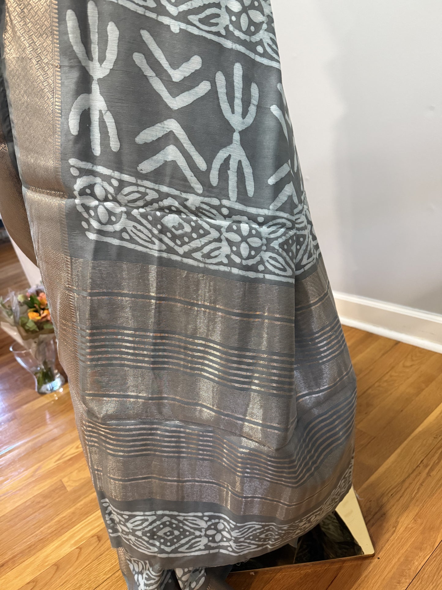 Hand block Batik Gray Maheshwari Silk Saree with silver zari border.