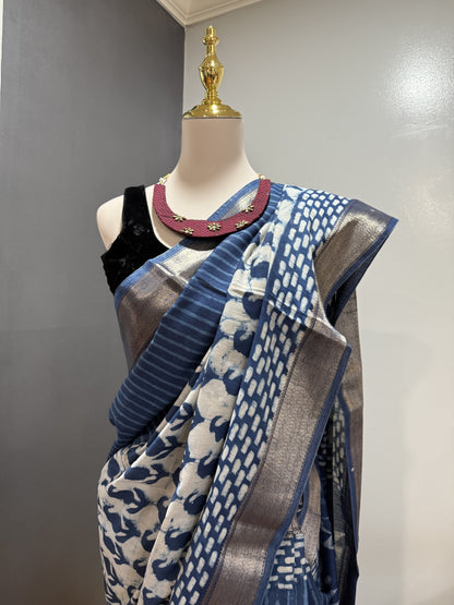 Hand block Batik Blue Maheshwari Silk Saree with silver zari border.