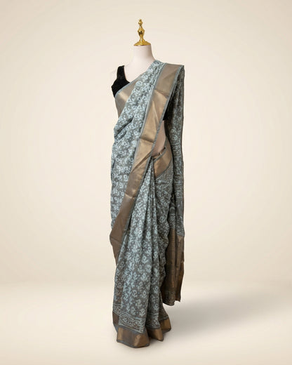 Hand block Batik Gray Maheshwari Silk Saree with silver zari border.