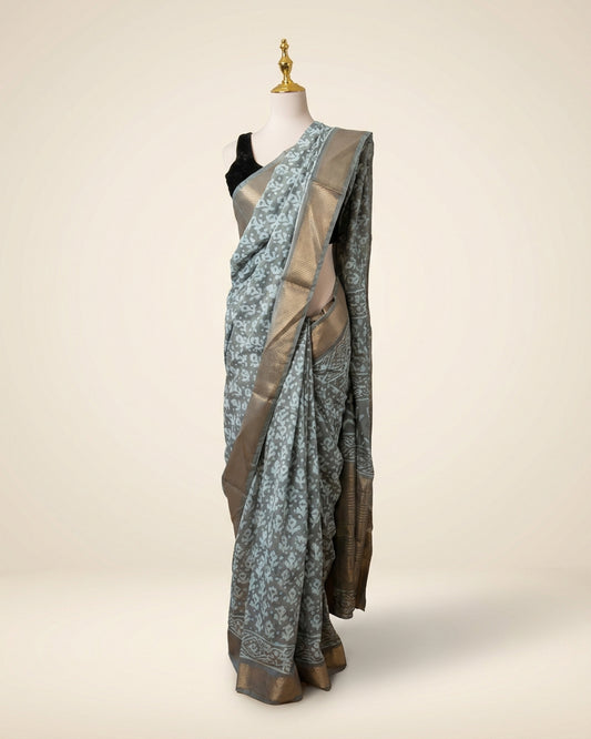 Hand block Batik Gray Maheshwari Silk Saree with silver zari border.