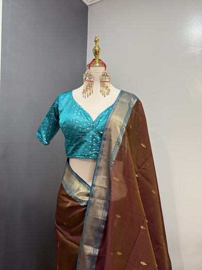 Handwoven Maheshwari silk cotton saree in coffee color and teal border.